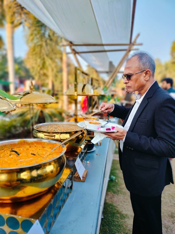 Guest being served at an outdoor catering event