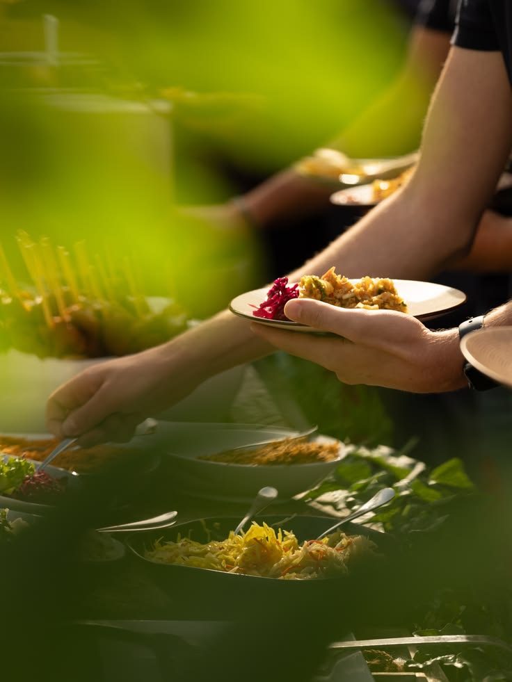 Guests being served from a live counter outdoors